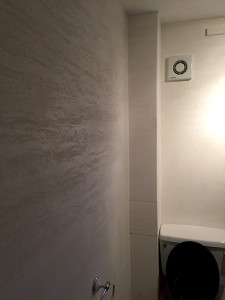 Travertine finish bathroom by All Saints Plastering